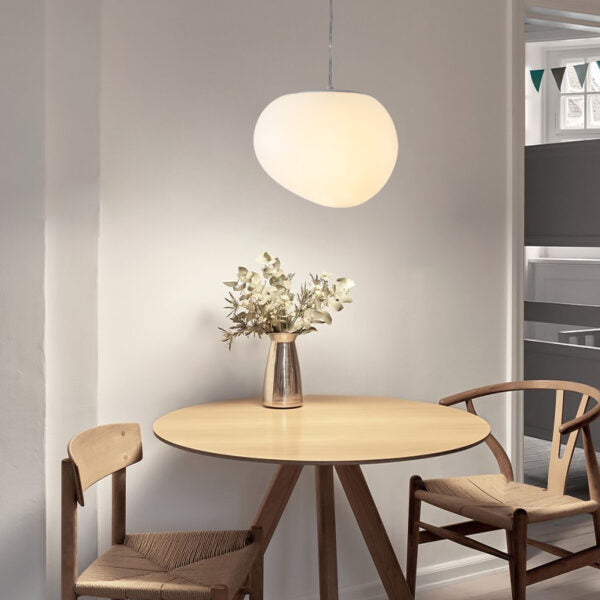 Creating a Warm and Minimalist Dining Space with Soft Pendant Lighting
